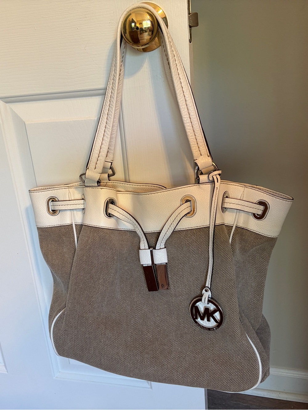 Michael Kors Beige and Cream Drawstring Canvas Tote with MK Charm